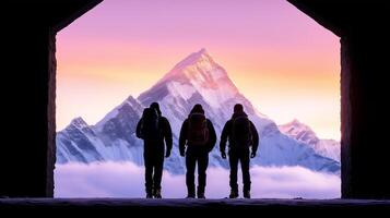 Three hikers stand silhouetted against stunning mountain backdrop at sunrise, evoking sense of adventure and exploration photo