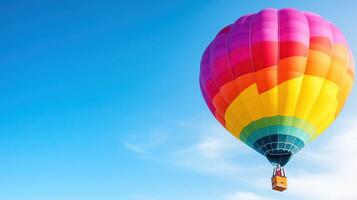 vibrant hot air balloon floats gracefully in clear blue sky, showcasing beautiful array of colors that evoke sense of adventure and freedom photo