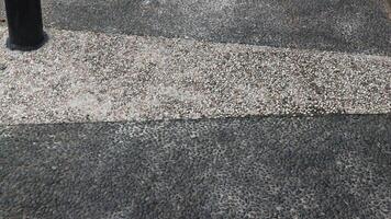 Exposed aggregate concrete with different colored pebbles. Gravel floor in city park. photo