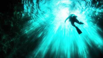 Diver exploring underwater depths, surrounded by vibrant blue light and shimmering water. serene atmosphere evokes sense of adventure and tranquility photo