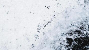 Water splashes create dynamic patterns, showcasing beauty of natures movement and energy. droplets dance in air, reflecting light and creating refreshing atmosphere photo