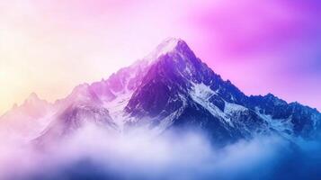 Majestic mountain peak surrounded by clouds, showcasing vibrant purple and pink hues in sky. breathtaking view that evokes sense of wonder and tranquility photo