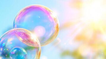 Bubbles float gracefully in bright blue sky, reflecting sunlight and creating colorful display. scene evokes sense of joy and playfulness, perfect for capturing essence of sunny day photo