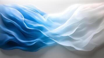 beautiful abstract representation of flowing fabric in shades of blue and white, creating serene and calming atmosphere. gentle waves evoke sense of tranquility and elegance photo