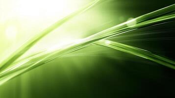 Lush green grass blades glisten under bright sunlight, creating serene and refreshing atmosphere. vibrant hues and soft light evoke sense of tranquility and natures beauty photo