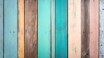 Colorful wooden planks create vibrant and rustic background, showcasing mix of turquoise, brown, and pastel shades. This textured surface adds warmth and character to any design photo