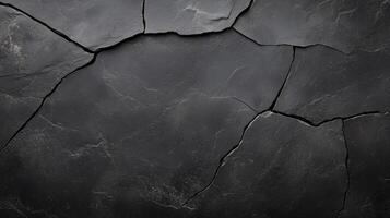 Cracked black stone surface with deep fissures and textured appearance, creating dramatic and moody backdrop. intricate patterns evoke sense of age and natural beauty photo