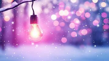 glowing light bulb hangs against dreamy background of soft bokeh and falling snowflakes, creating magical winter atmosphere photo