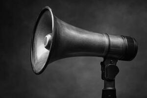 Black Vintage Megaphone on a Gray Background photo