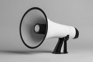 White Megaphone with Black Accents on a Gray Background photo