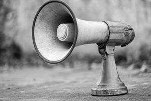 Worn Vintage Megaphone on Rough Surface photo