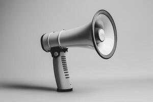 White Megaphone with Black Handle on a Gray Background photo