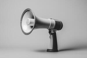A White Handheld Megaphone on a Grey Background photo