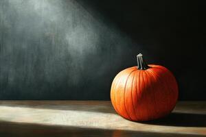 A Single Pumpkin Under A Beam of Light photo