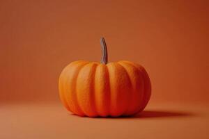 Single Orange Pumpkin on a Solid Orange Background photo