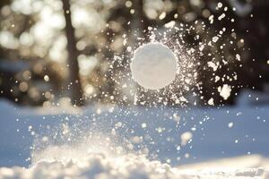 A snowball flying through the air, creating a spray of snow photo