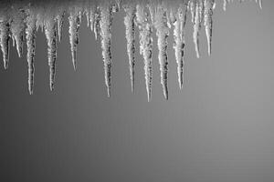Close-up of Sharp Icicles Hanging from an Eaves photo