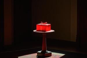 A Red Gift Box on a Pedestal in a Dark Room photo