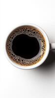 Top view of a cup of aromatic black coffee with rich crema, freshly brewed. White background. caffeine photo