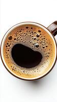 Top view of a cup of aromatic black coffee with rich crema, freshly brewed. White background. caffeine photo