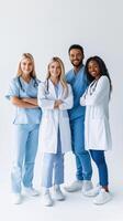 Confident group of diverse healthcare professionals standing together in modern medical uniforms photo