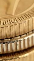 Close-up of coin edge. serrations and detailed texture pattern of golden coins in macro view photo