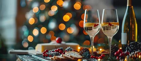 Festive holiday table with champagne, cheese, bread, and grapes with Christmas lights in background photo