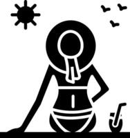 A woman in a bikini sitting on a beach vector