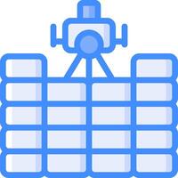 A blue and white image of a camera on top of a stack of boxes vector