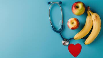 A stethoscope, bananas and apples on a blue background photo