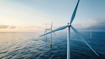 Wind turbines in the ocean at sunset photo