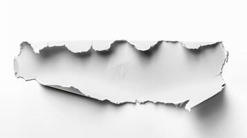 A piece of paper torn in half on a white background photo