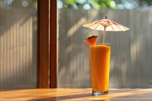 A glass with an umbrella photo
