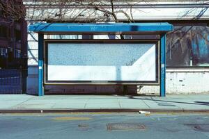 A bus stop with a white board on it photo