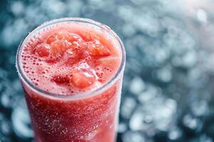 A glass of strawberry juice with bubbles photo