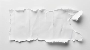A piece of white paper torn in half photo