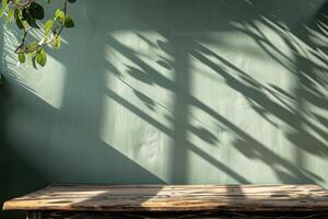 A wooden bench sitting in front of a green wall photo
