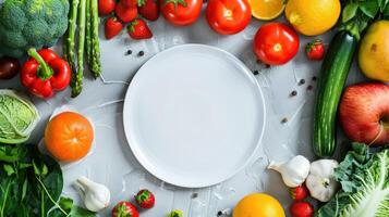 A white plate surrounded by various fruits and vegetables photo