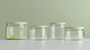 Four empty glass jars with lids on a table photo