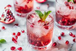 Pomegranate cocktail with mint leaves and ice photo
