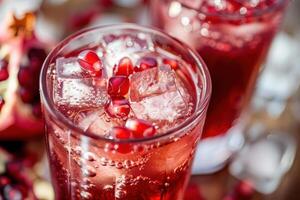 Pomegranate juice with ice and pomegranate photo