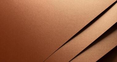 Copper metallic texture with layered folds and a reflective surface. Diagonal geometric lines create photo