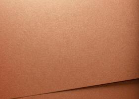 Copper texture with folded material creating an abstract pattern. Decorative designer paper in brown photo