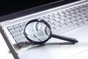SEO search concept with keyword optimization on a website. Laptop and keyboard used for business photo