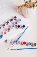 Home painting kit for painting by numbers on the table vertical view photo