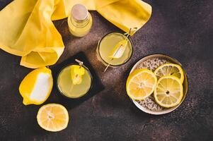 Traditional homemade limoncello in glasses on the table top view photo