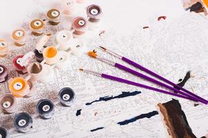 Simple hobby for relaxation painting by numbers, set on the table photo