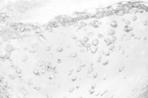 Air bubbles on a white background, perfect for designs and branding projects that highlight cleanliness and freshness photo