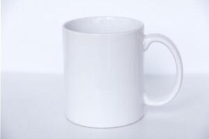 Elegant white ceramic mug isolated on a blank background, suitable for product marketing, mockups, and graphic design photo