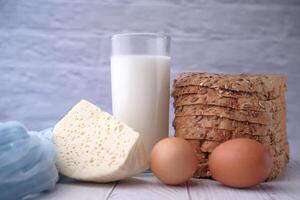 Fresh Ingredients An Array of Milk, Eggs, Cheese, and Artisan Bread Composition photo